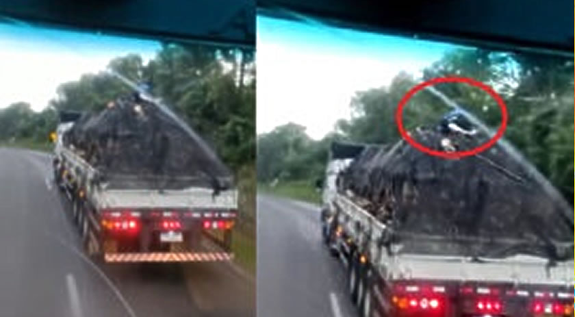 Homens são flagrados pegando ‘carona’ na carga de um caminhão, na BR-153